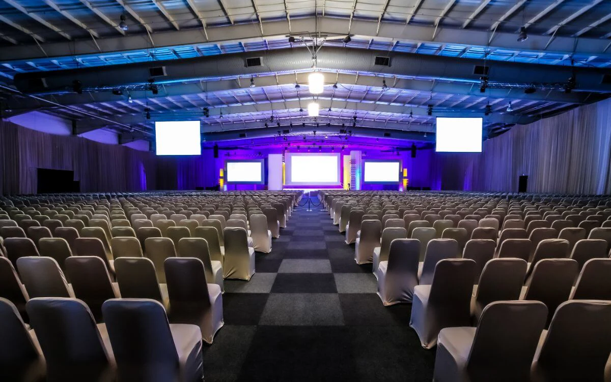 A live event stage with screens